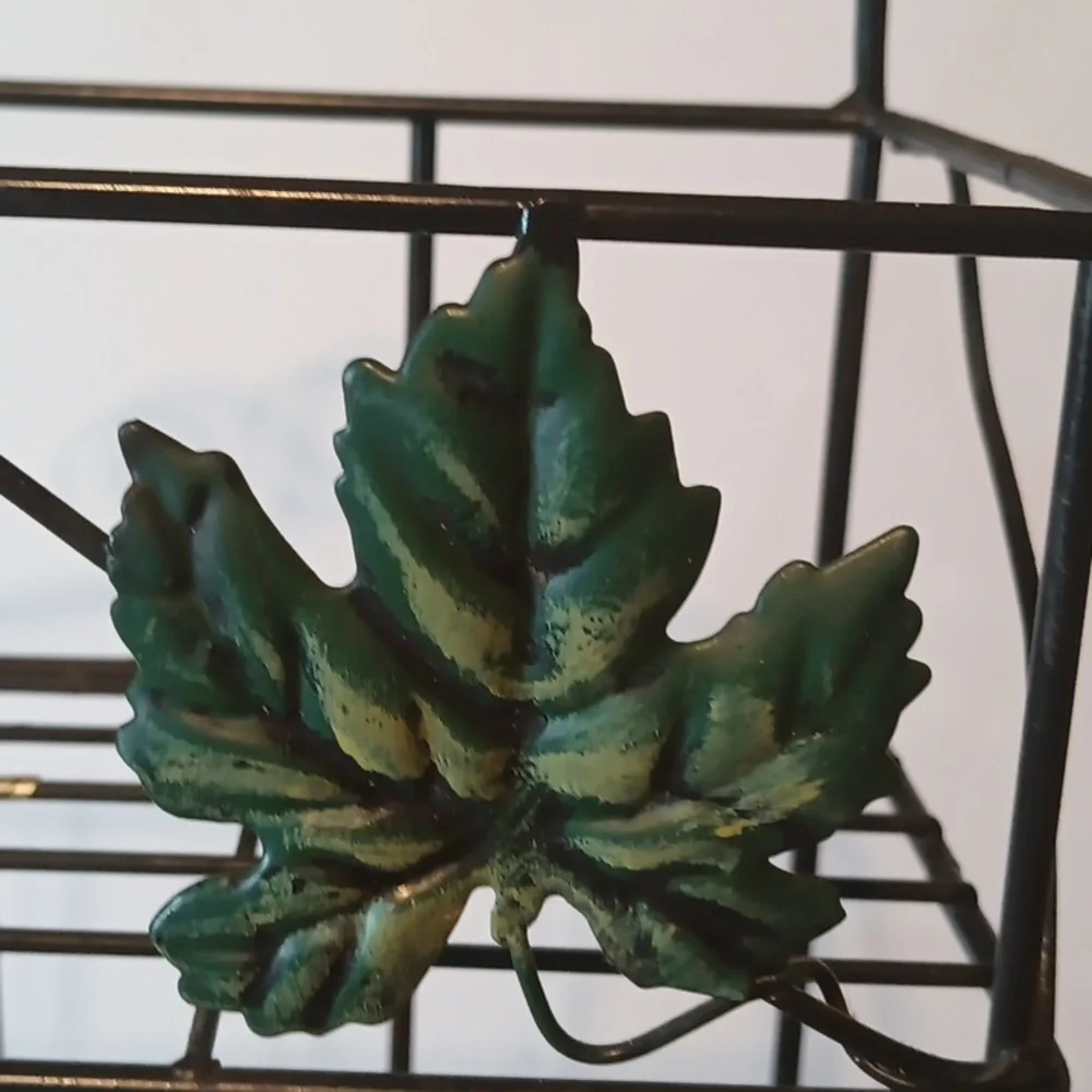 Source Unknown Black and Green Display Shelves with Nature-Inspired Design